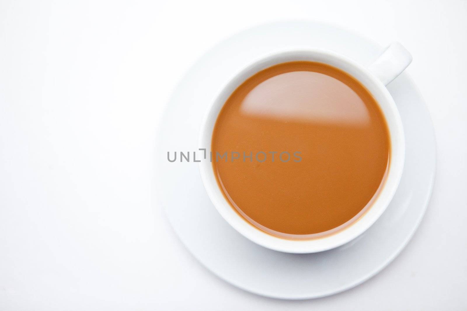 Cup of coffee with milk against white background