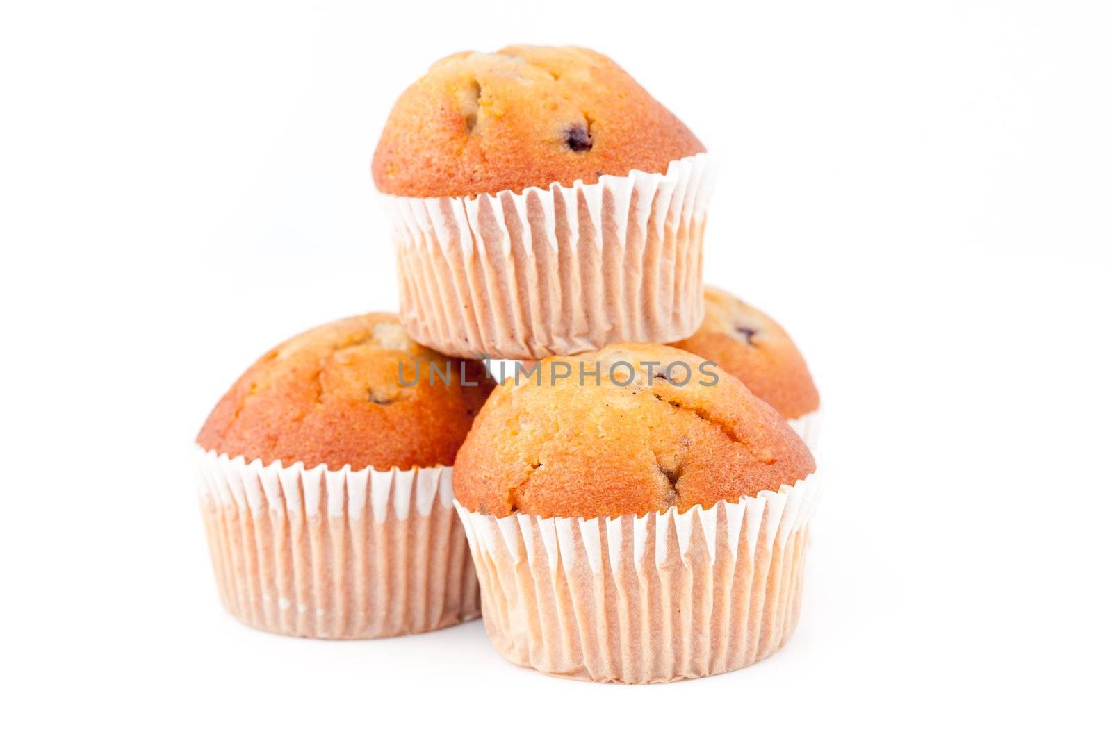 Pyramid of muffins against a white background