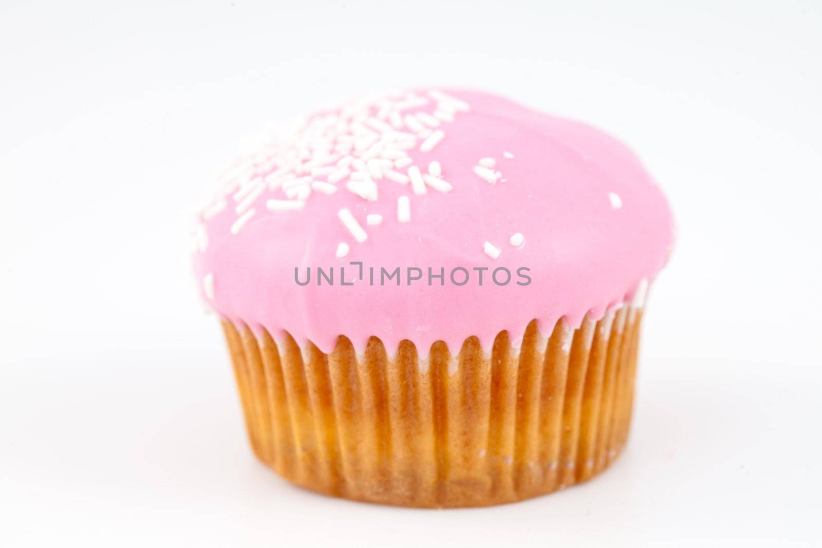 Muffin with icing sugar against a white background
