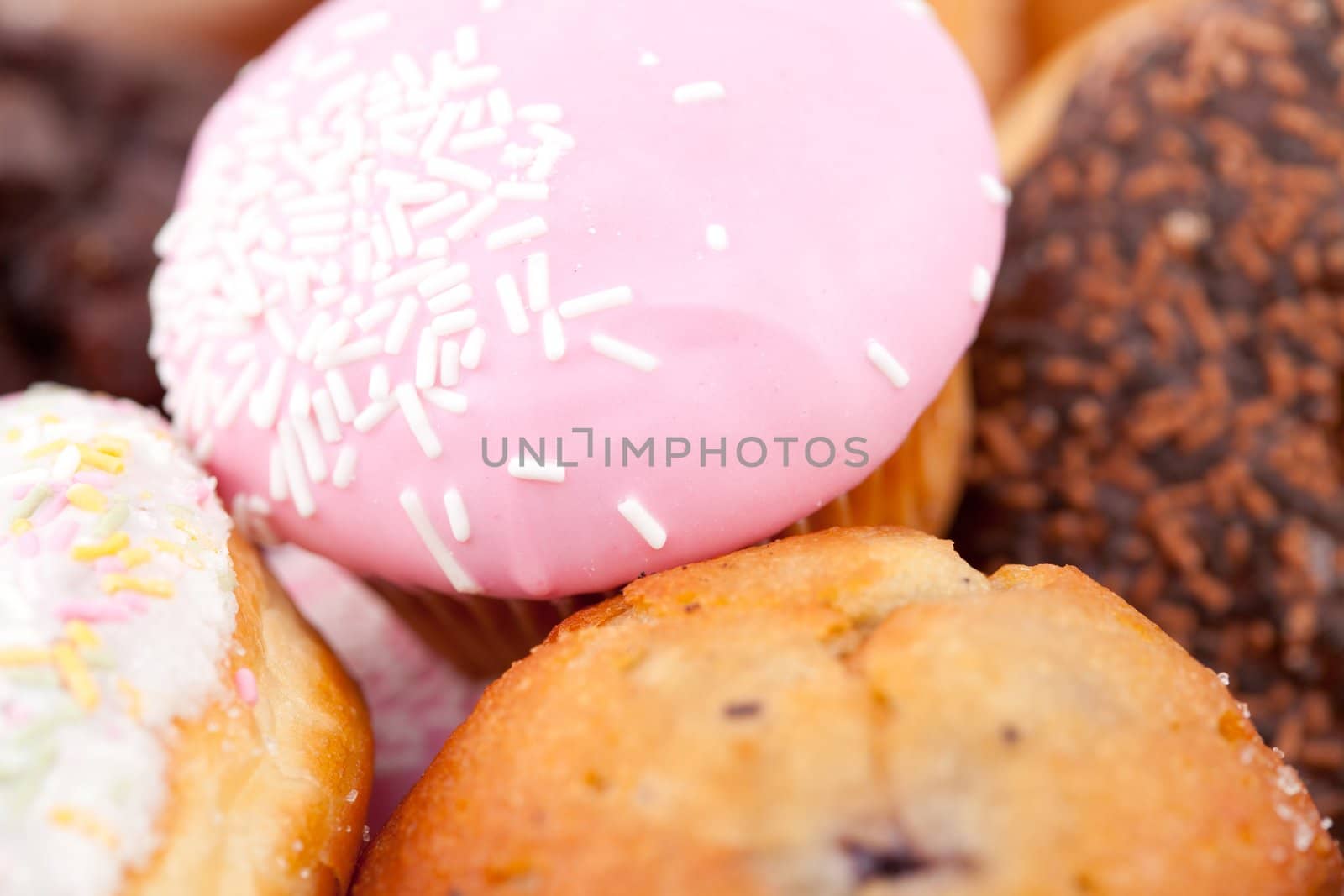 Close up on cakes with icing sugar against a white background