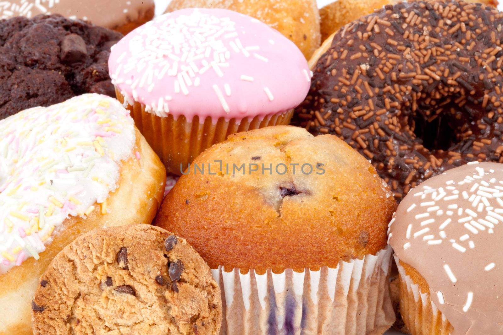 Cakes with icing sugar against a white background
