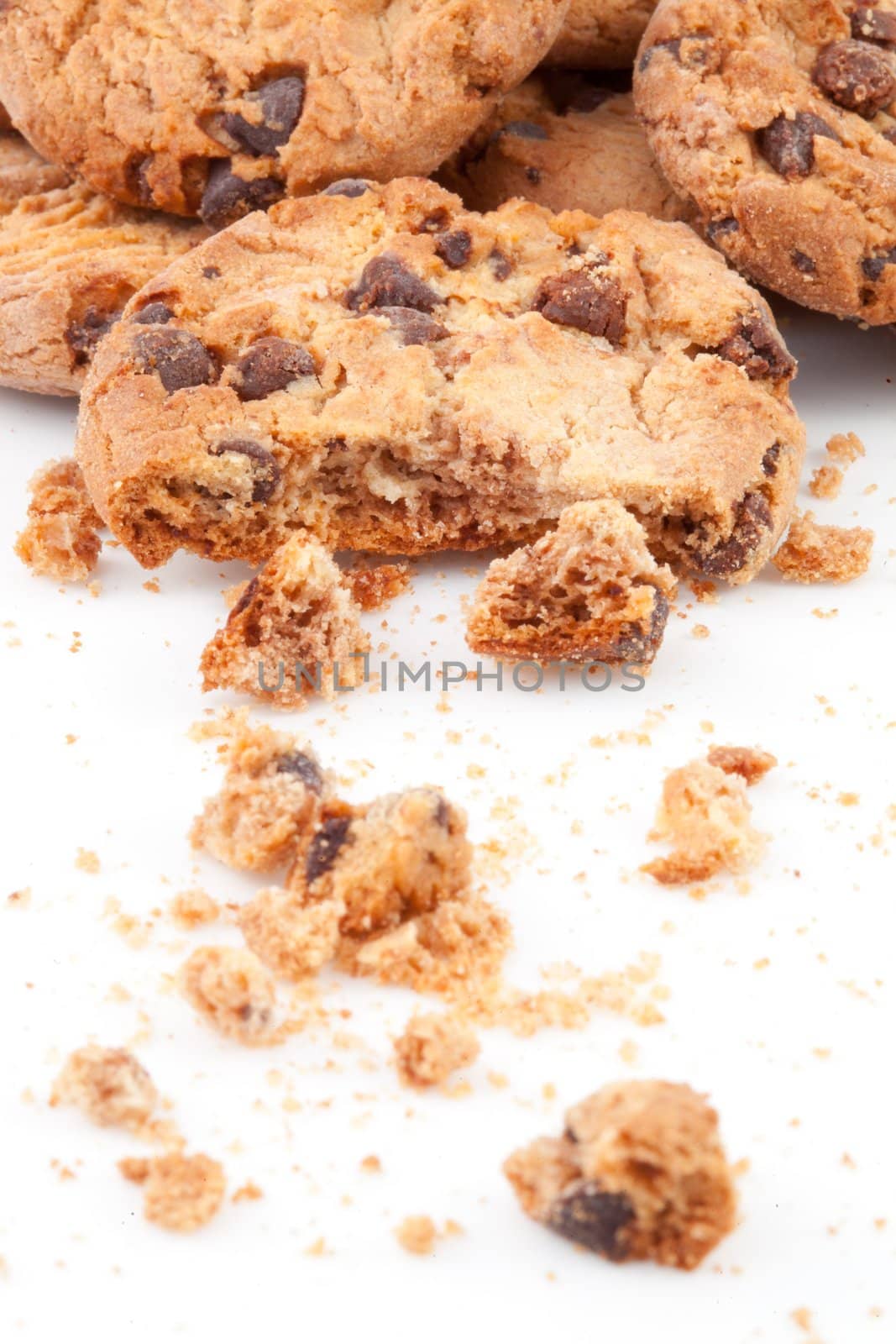 Close up of cookies piled up together against a white background