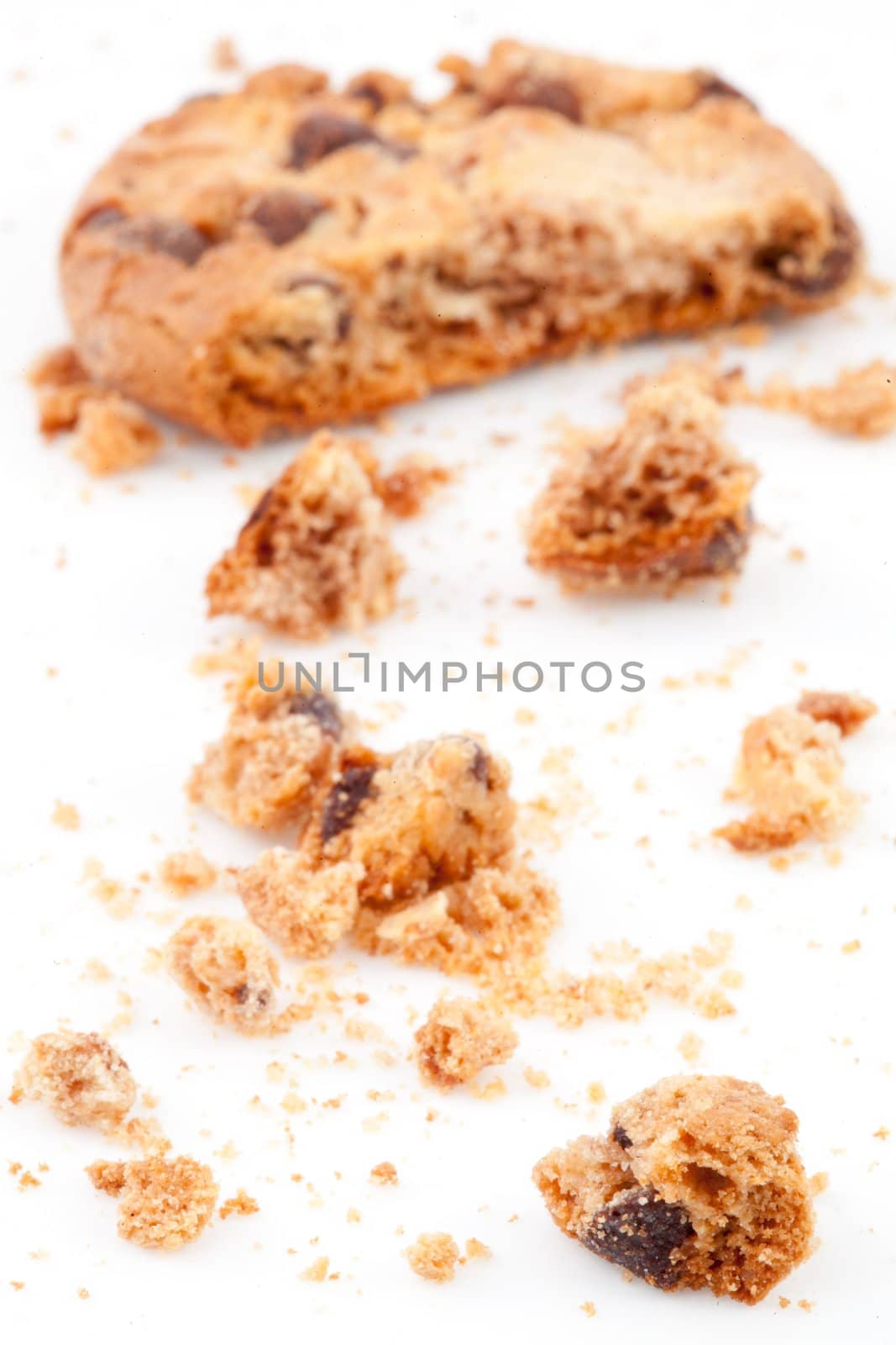 half eaten blurred cookie against a white background