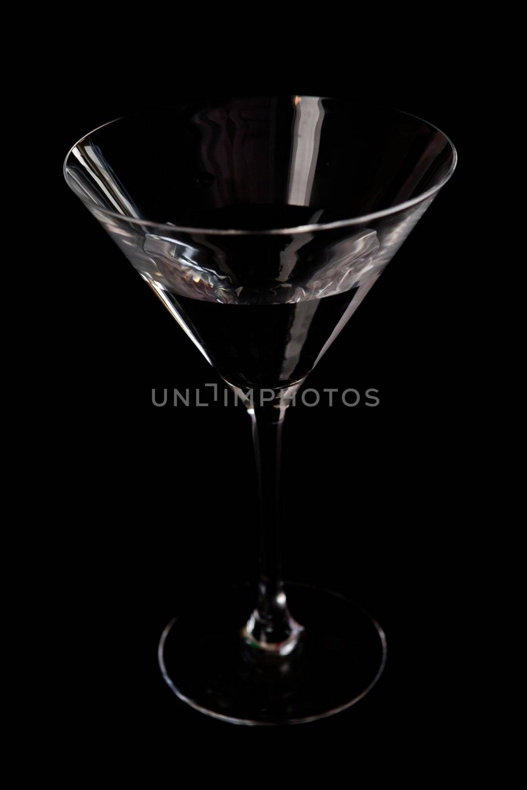 Cocktail glass against a black background