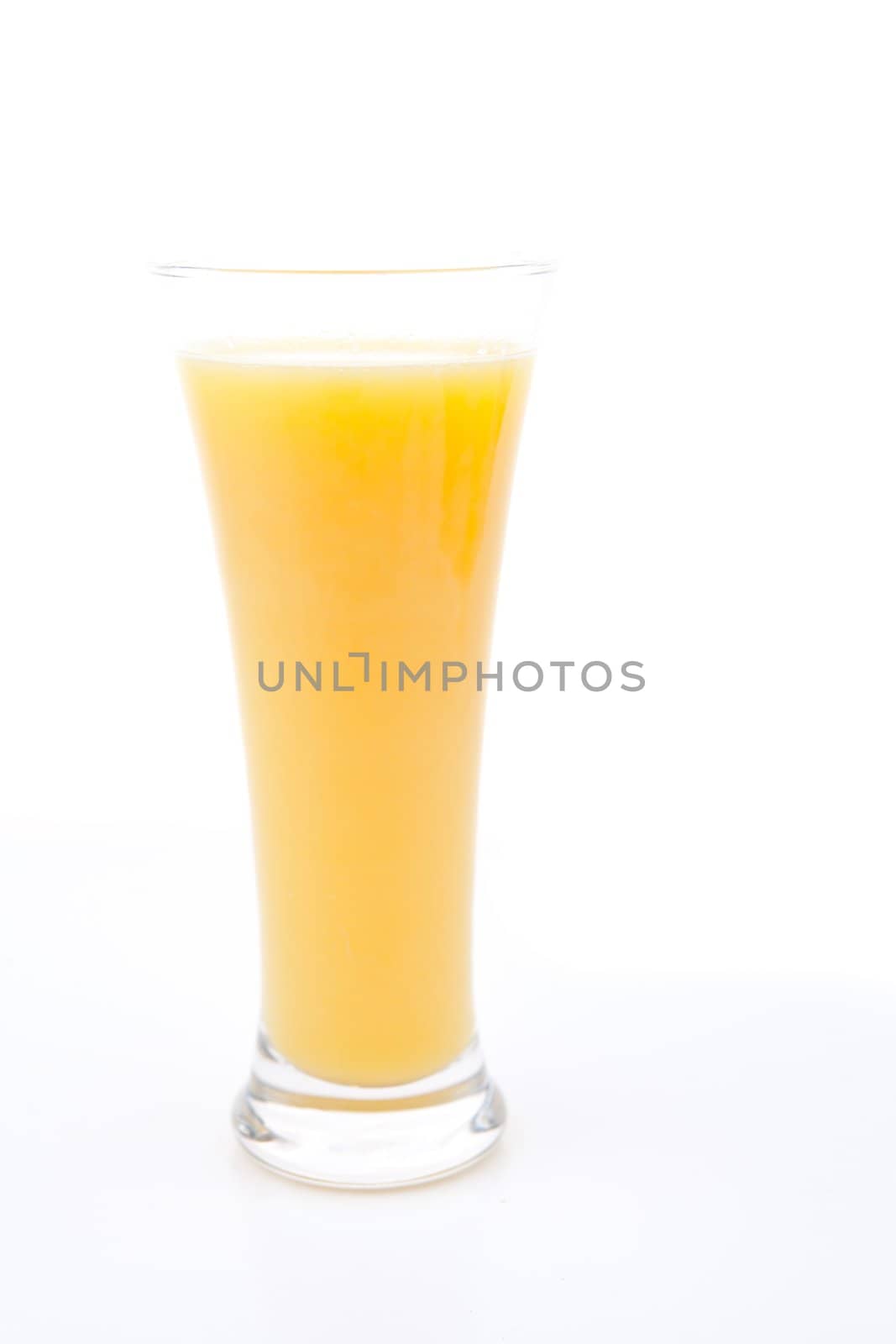 Glass full of orange juice by Wavebreakmedia