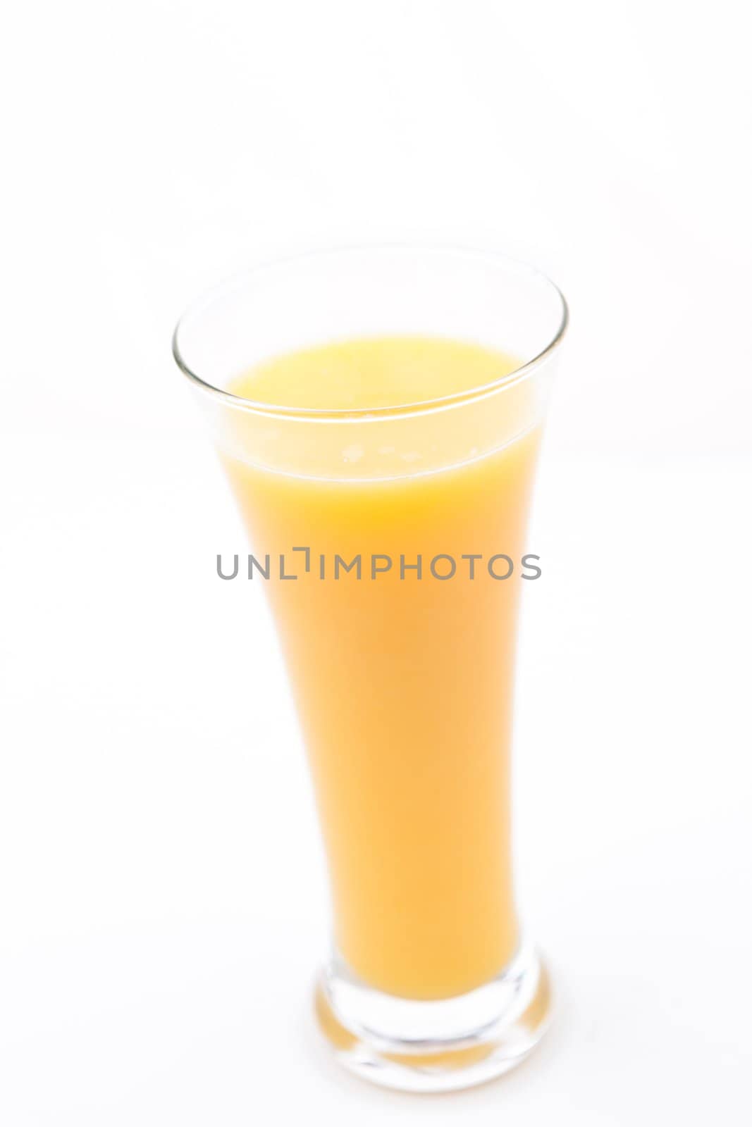 Full glass of orange juice by Wavebreakmedia