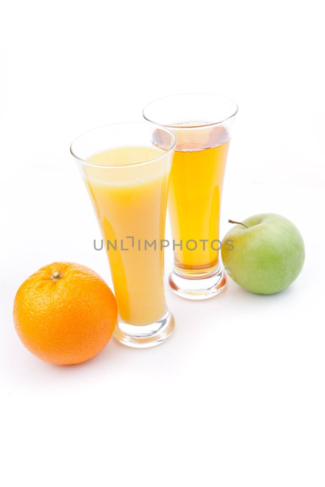 Glass of orange juice near a glass of apple juice against white background