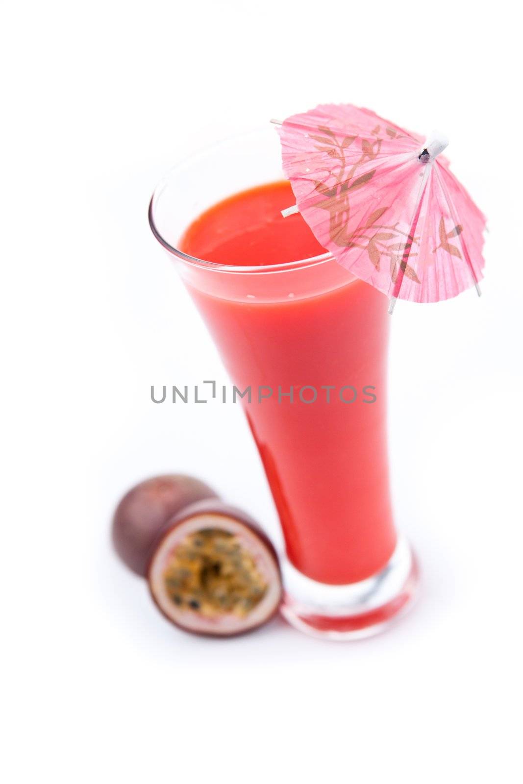 Passion fruit near a glass by Wavebreakmedia