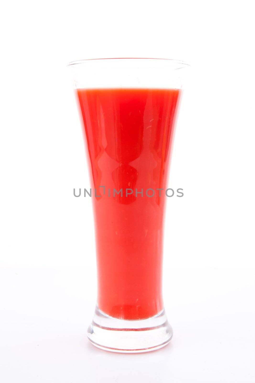 Glass of berries juice against white background