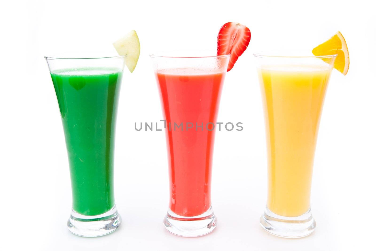 fruit pieces in a row of glasses