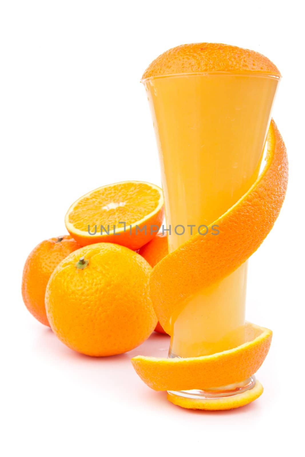 Orange peel wrapping a glass against white background