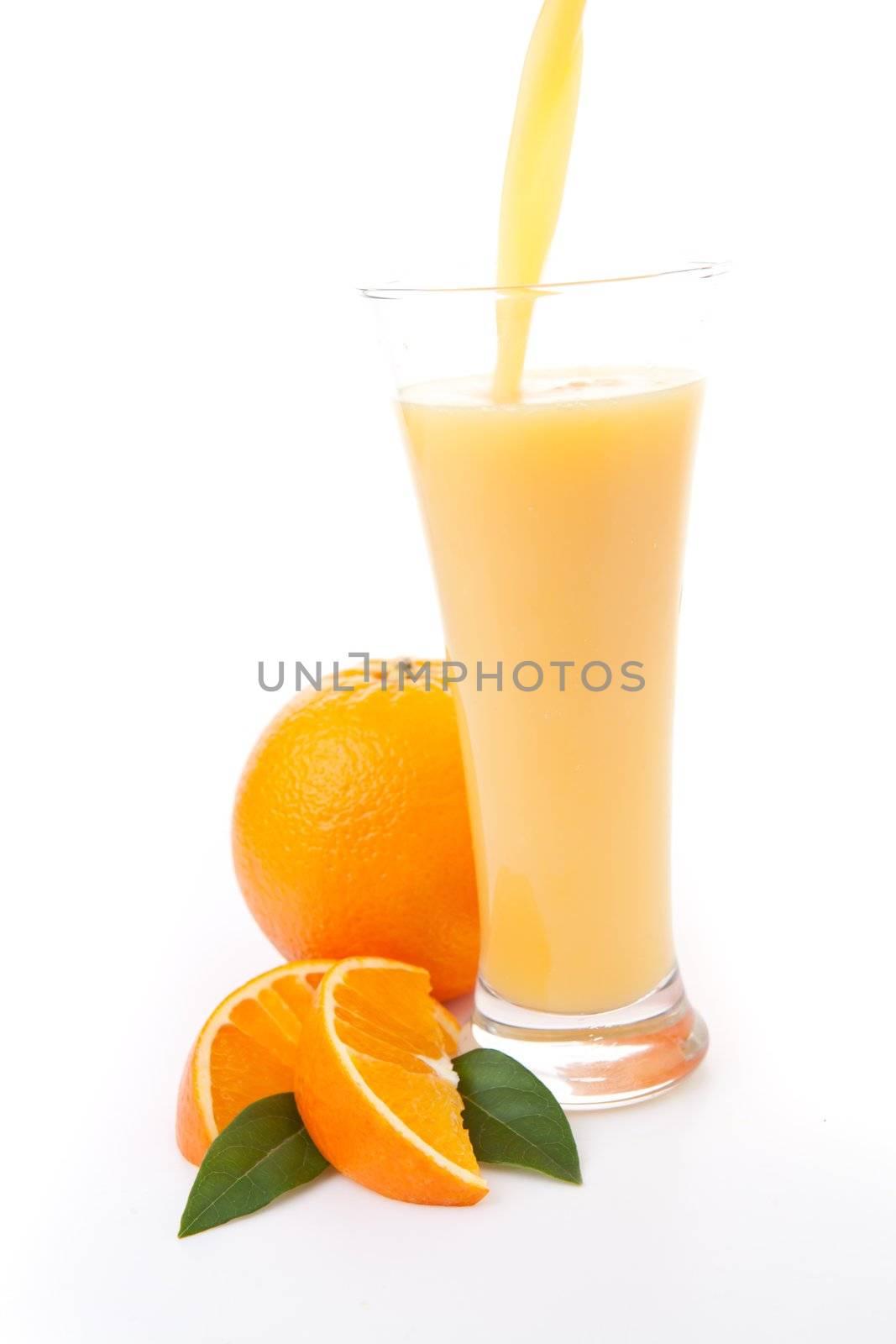 Orange juice  in a glass against a white background