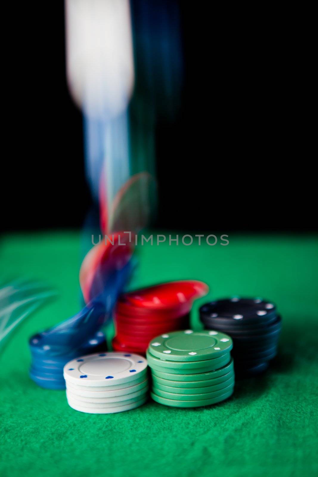 Drop of chips against a black background