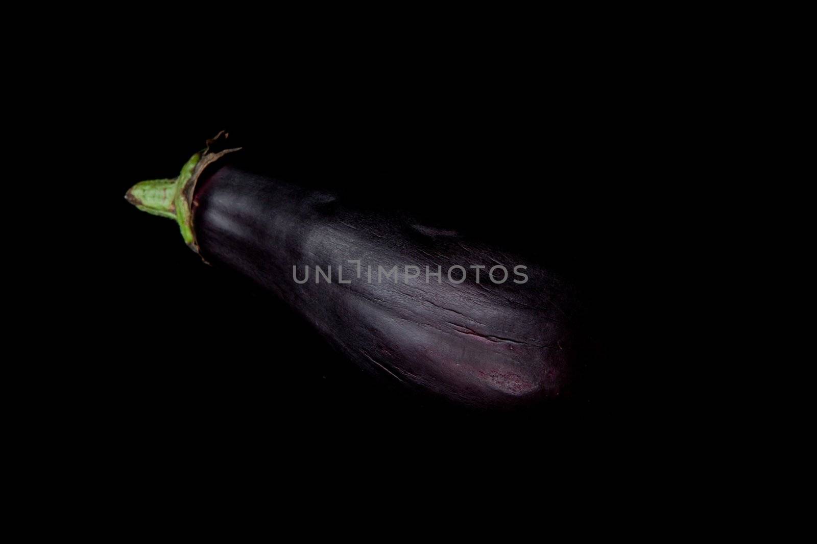 Eggplant against a black background