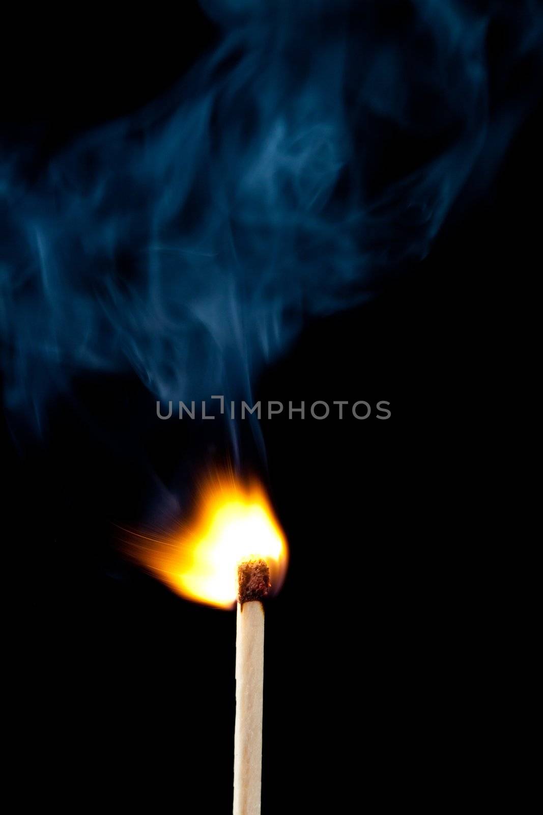 Setting fire to a match by Wavebreakmedia