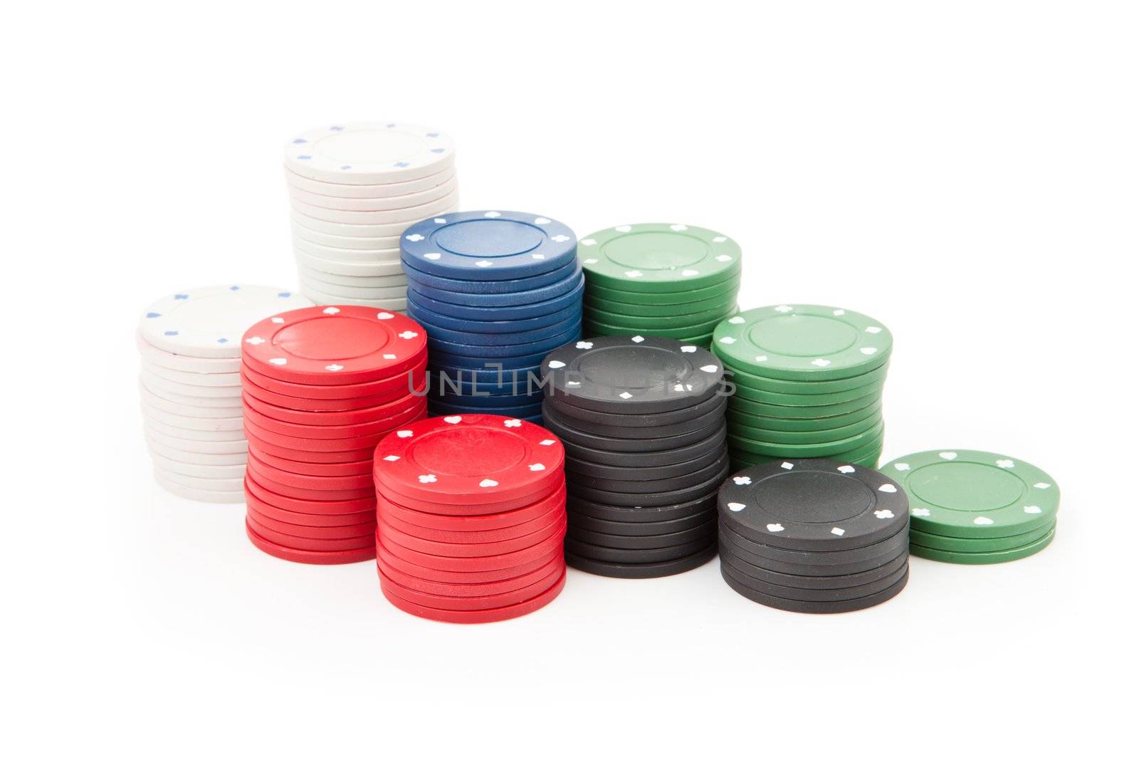 Poker coins stacked up together against a white background