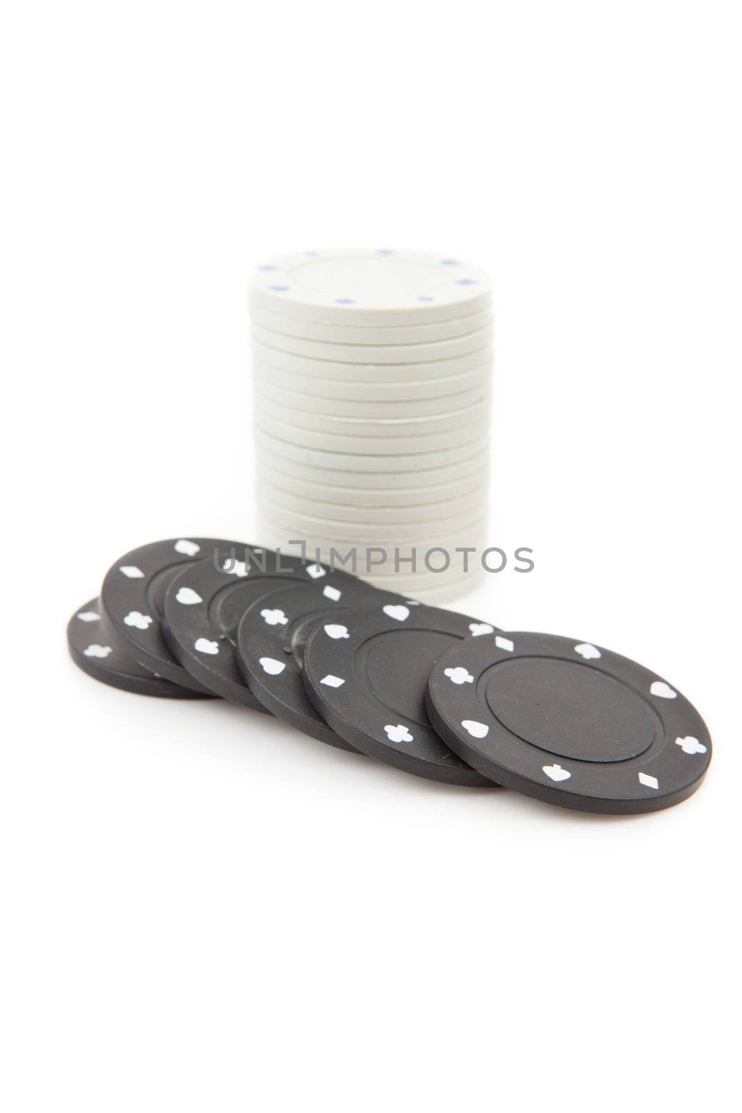 White and black poker coins by Wavebreakmedia