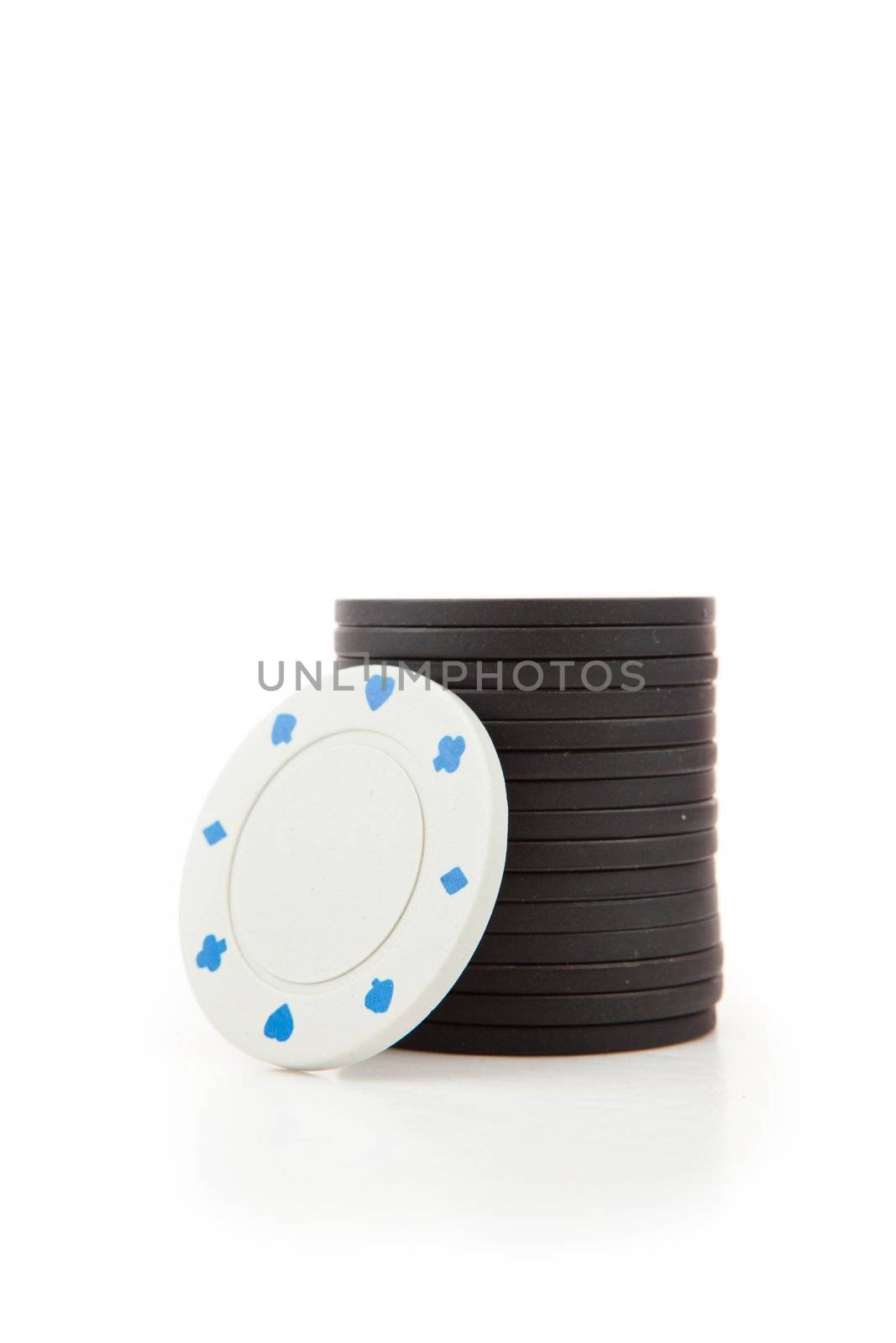 Black and white poker tokens against a white background