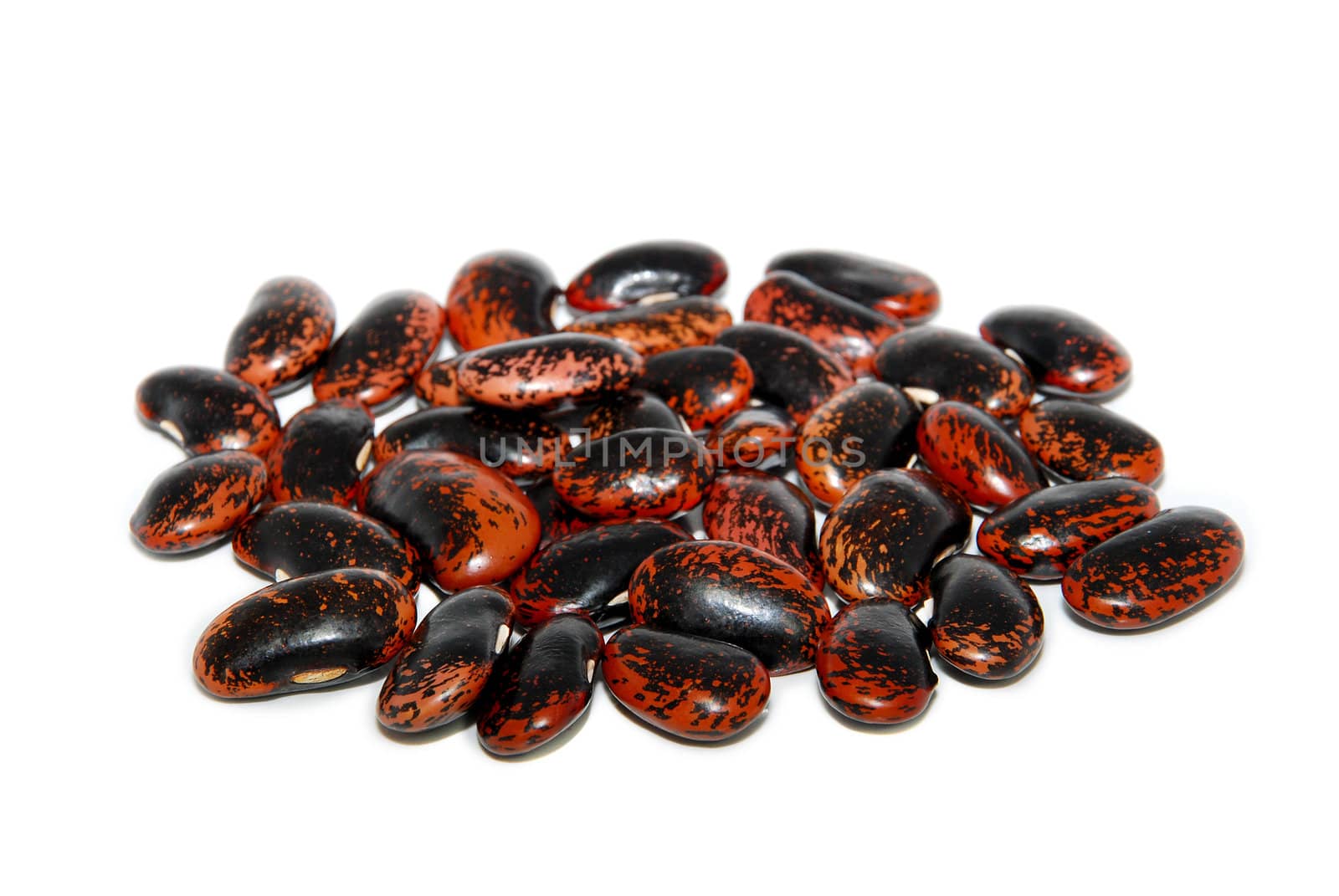 Pile of runner bean seeds, isolated on a white background