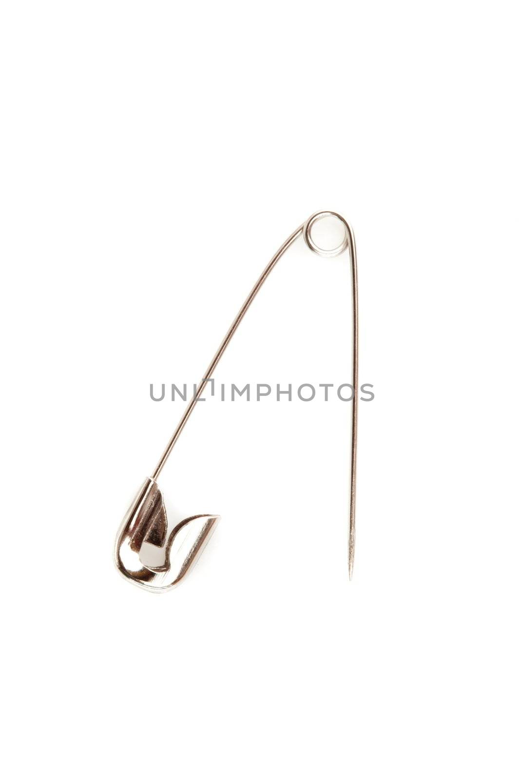 Close up of a safety pin opening against a white background