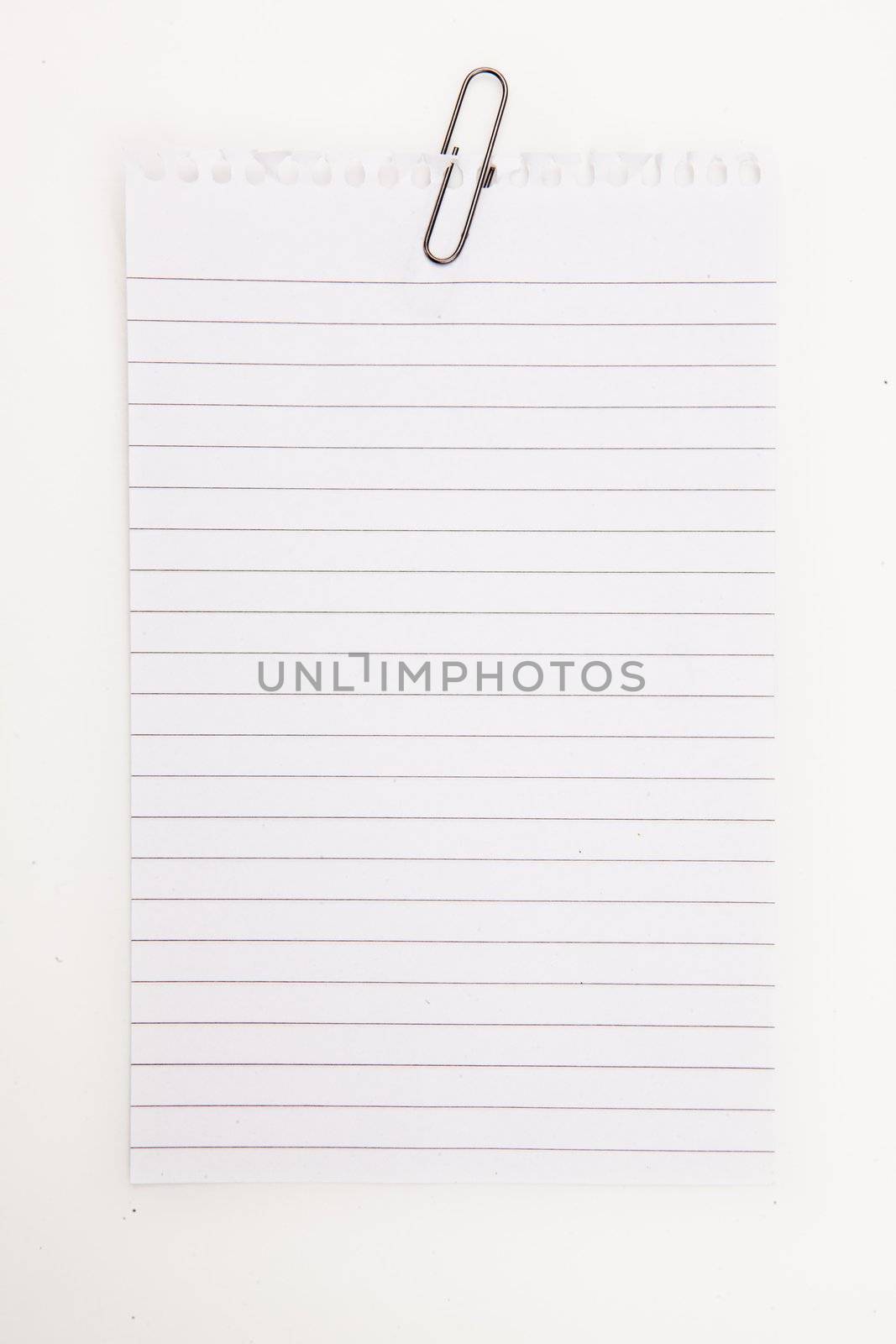 Blank page with grey paperclip against a white background