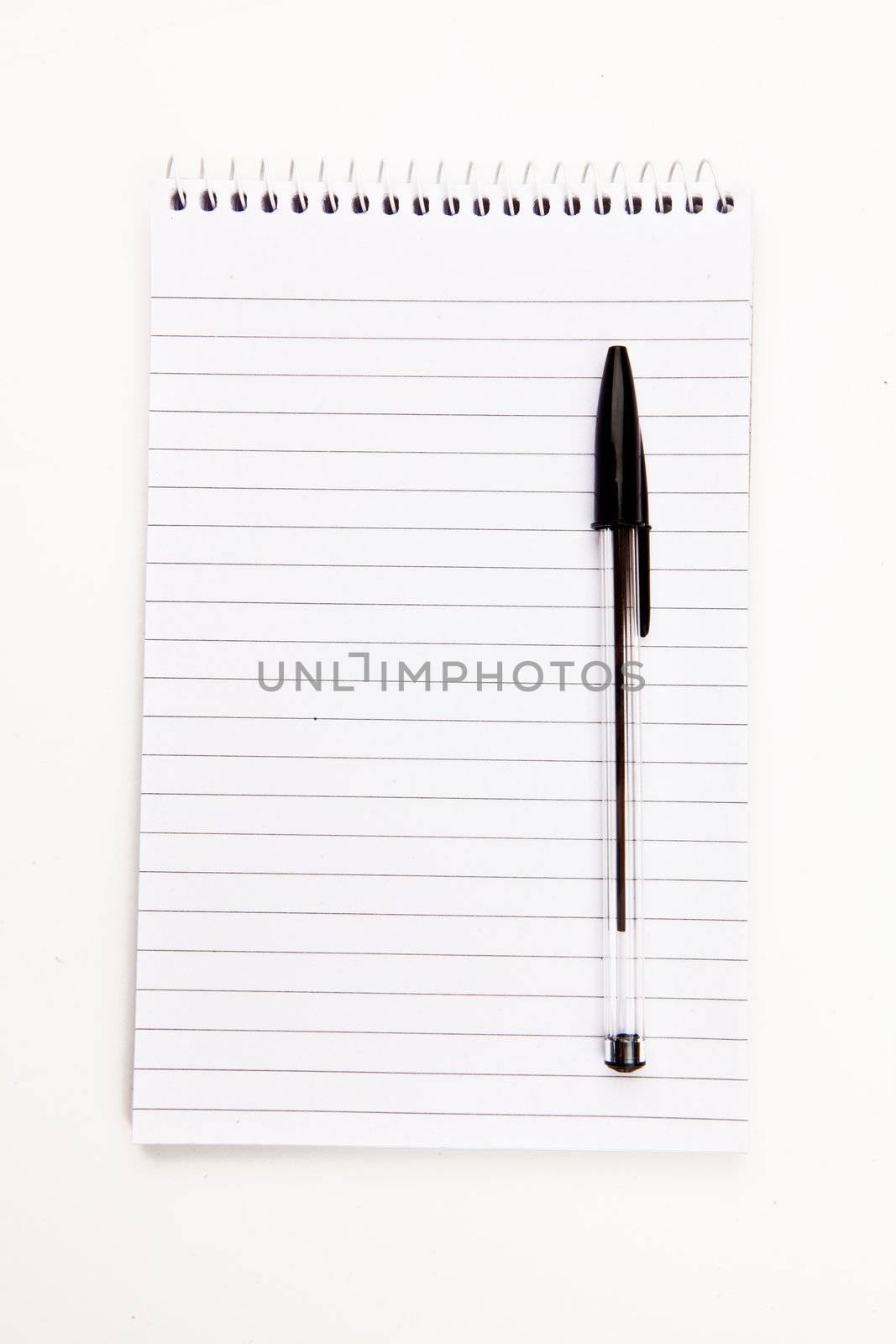 Notepad  with black pen sheet  against a white background