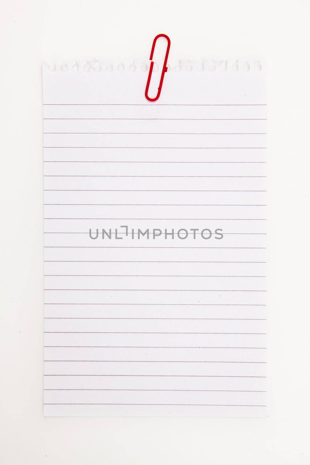 Blank page with red paperclip  against a white background