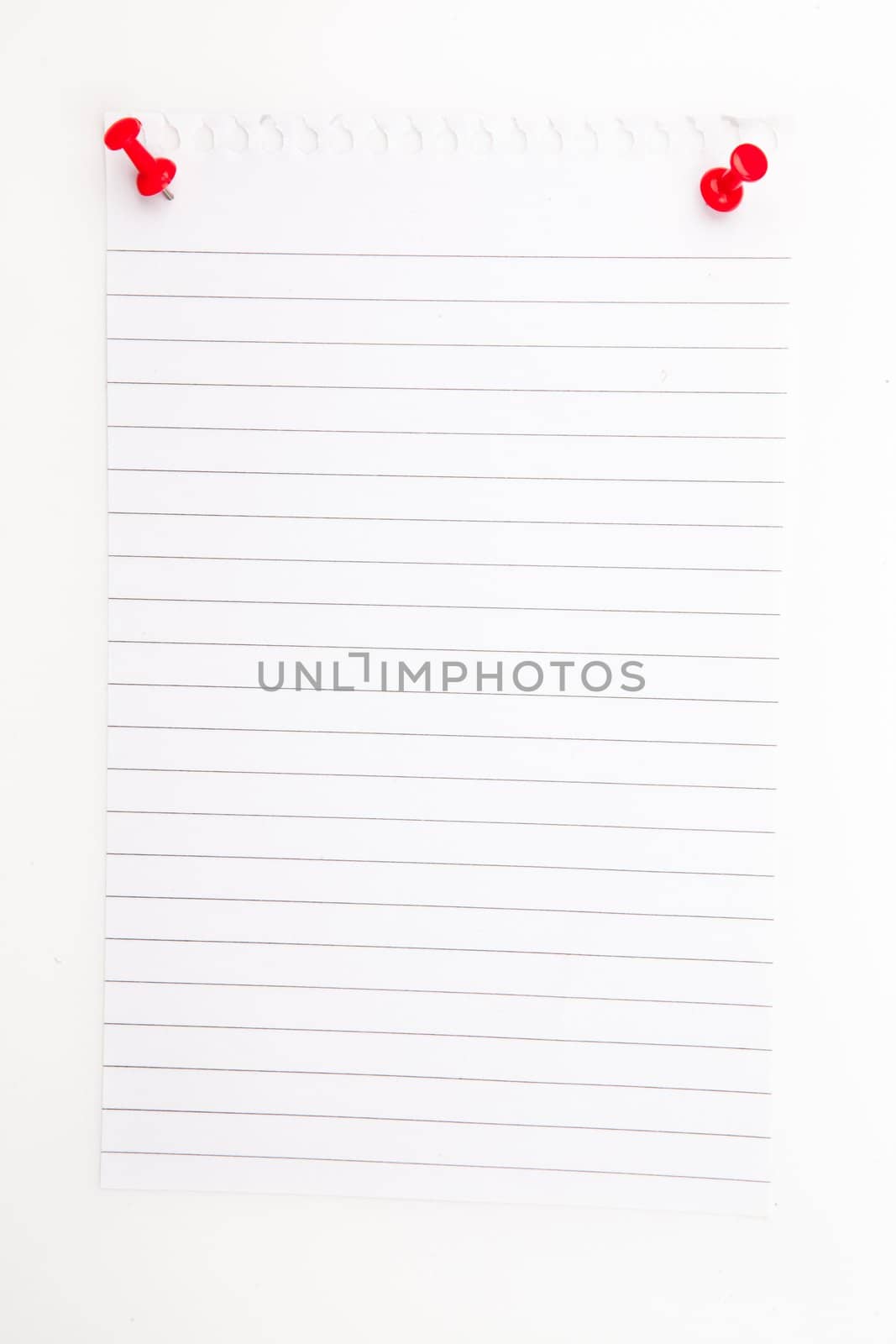 Blank paper with red pushpin against a white background