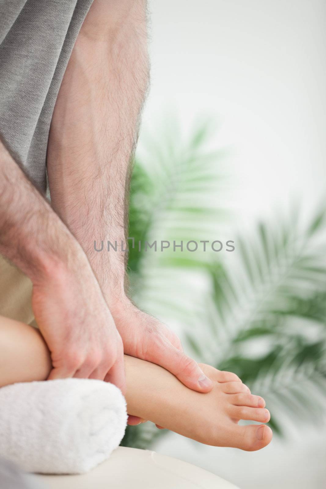 Close up of hands massaging a foot by Wavebreakmedia