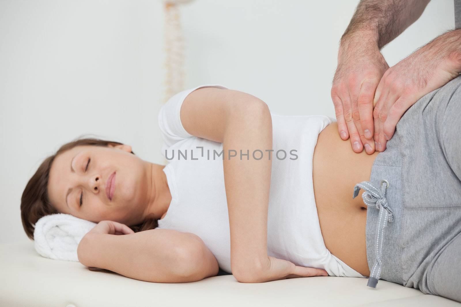 Peaceful woman being massaged by her practitioner by Wavebreakmedia