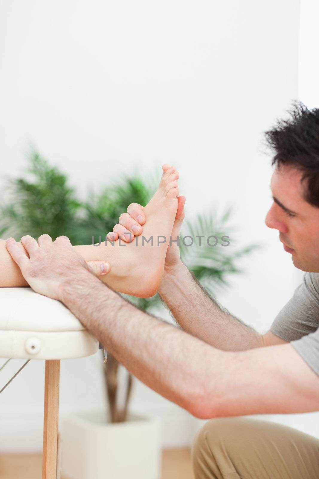 Close up of a physiotherapist massaging a foot by Wavebreakmedia