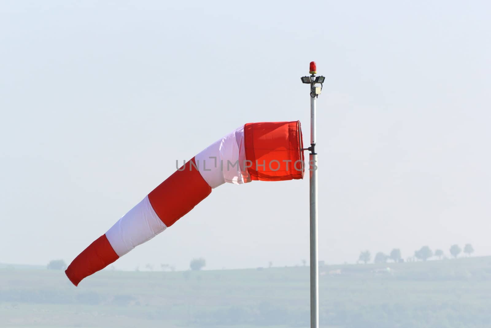 wind sock in an overcast day by taviphoto