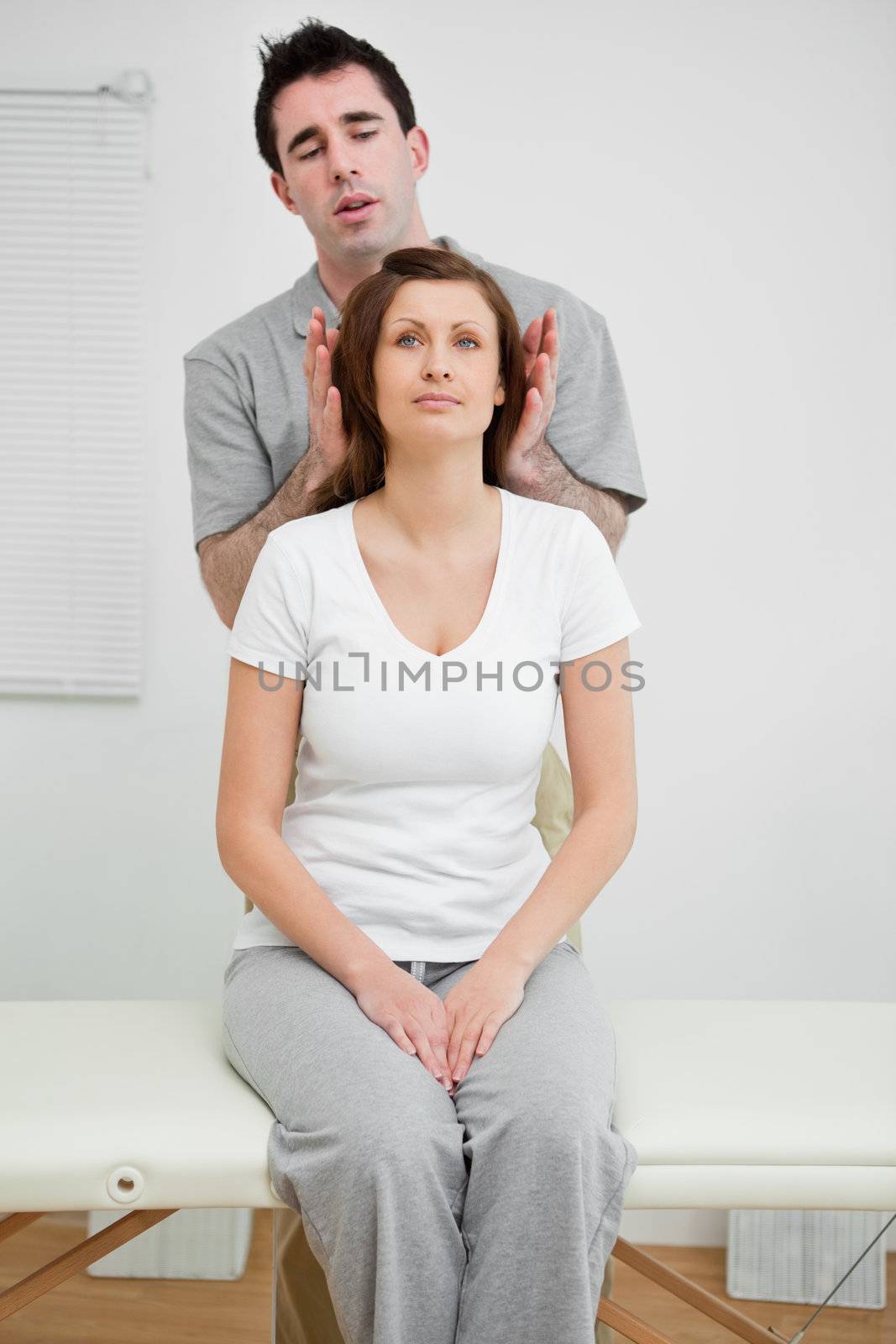 Woman sitting while being manipulated by Wavebreakmedia