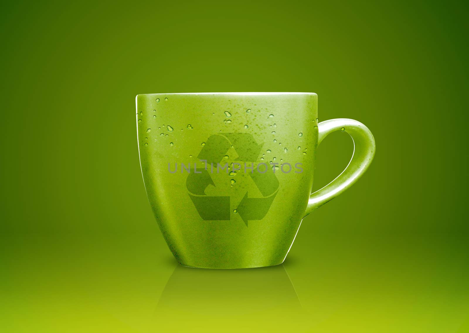 Green tea mug or cup with recycle sign on it, environmental conceptual image.