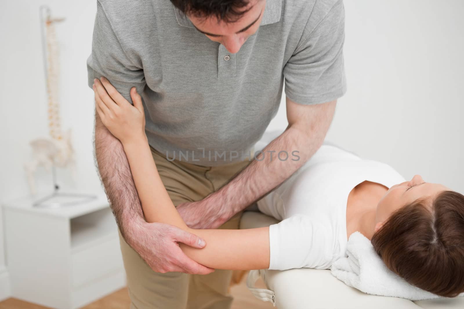 Woman lying while being massaged by Wavebreakmedia
