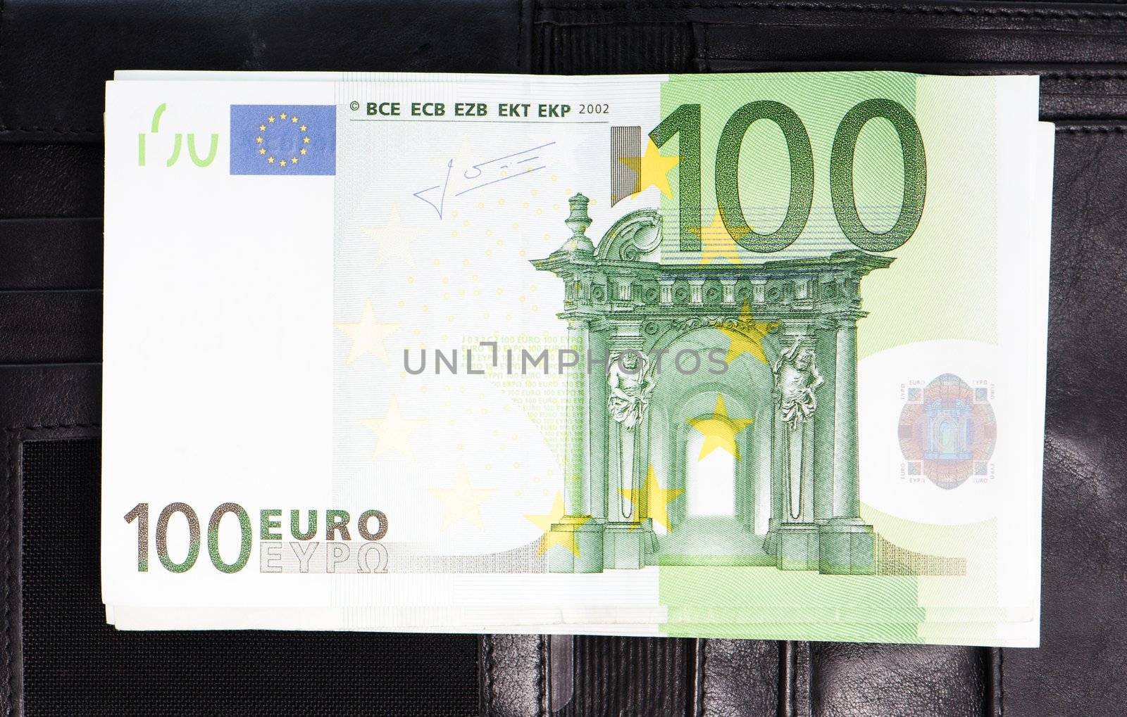 Euro banknotes on the black purse