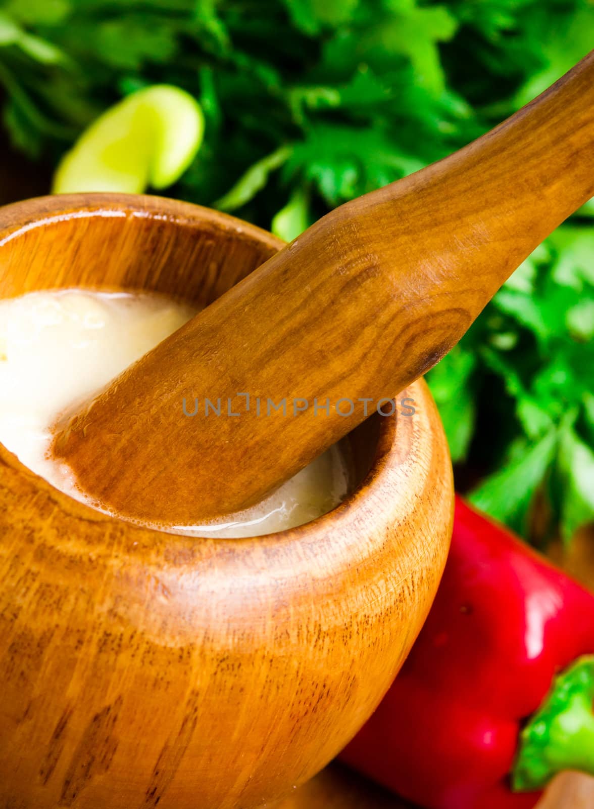 Close up image of garlic sauce in mortar