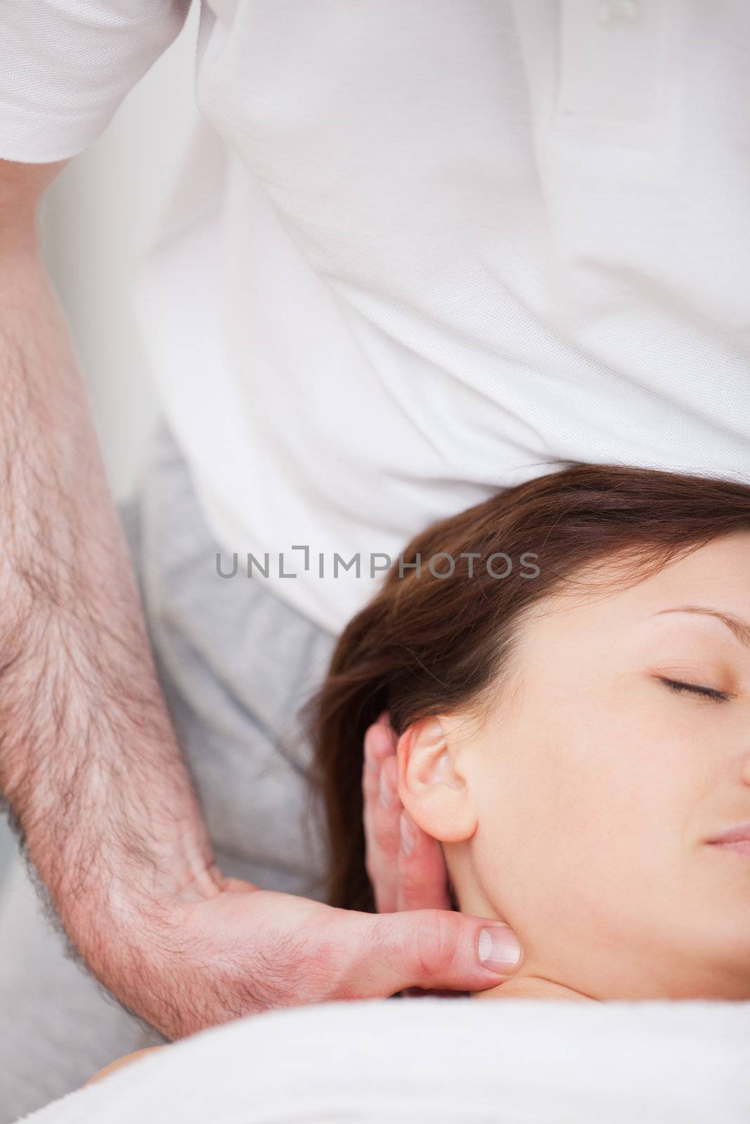 Close-up of woman being manipulating by a therapist by Wavebreakmedia
