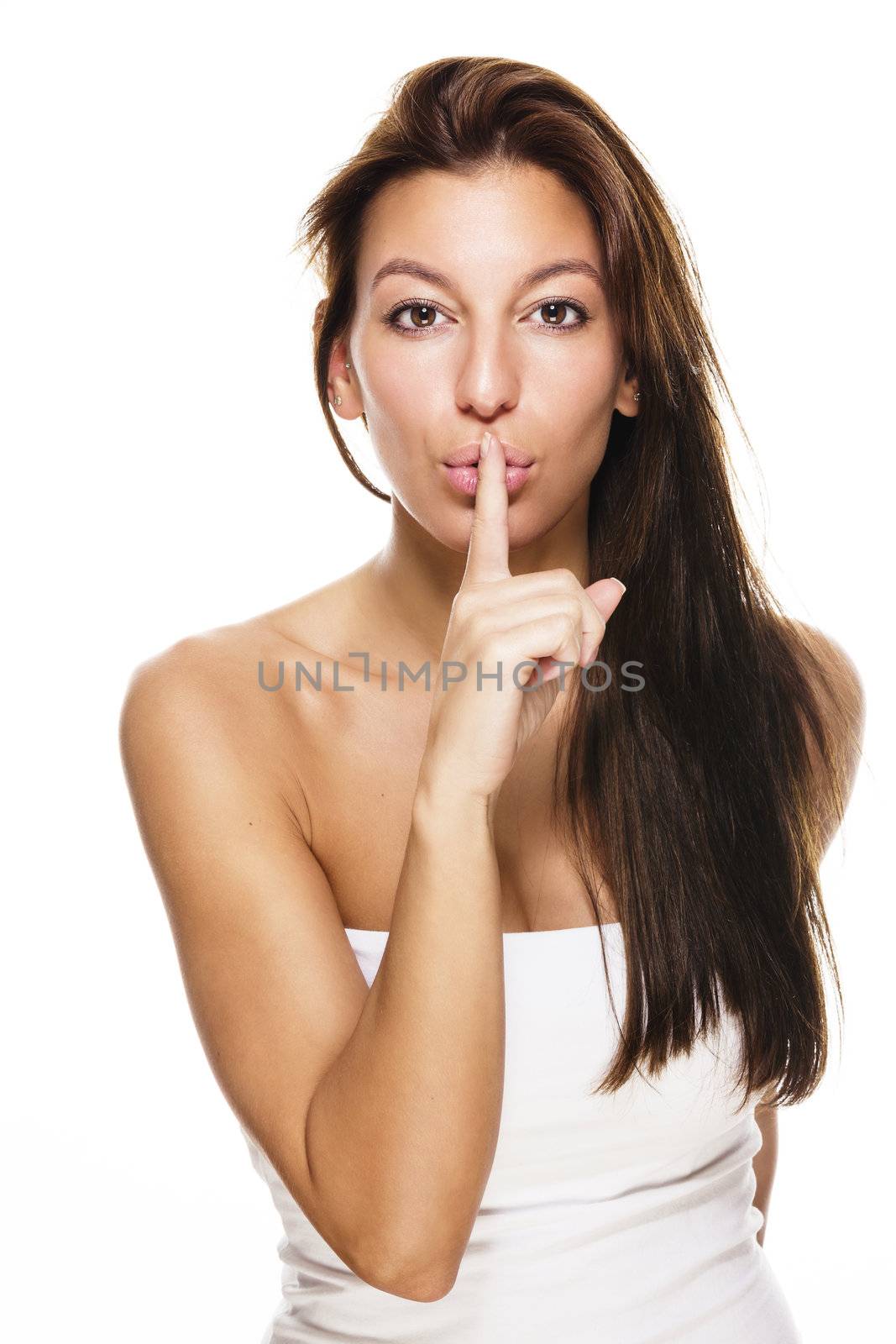 beautiful brunette woman making shush sign on white background