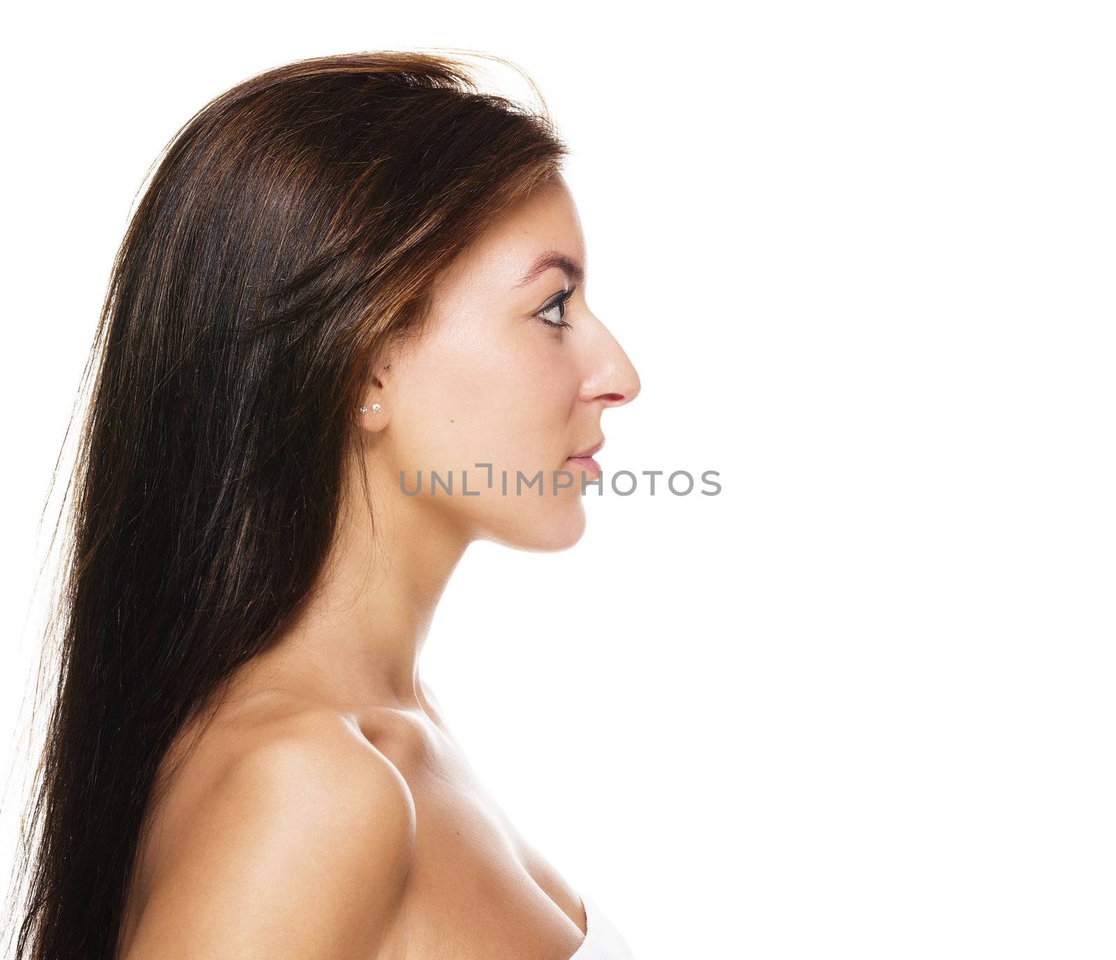side view of a beautiful brunette woman on white background