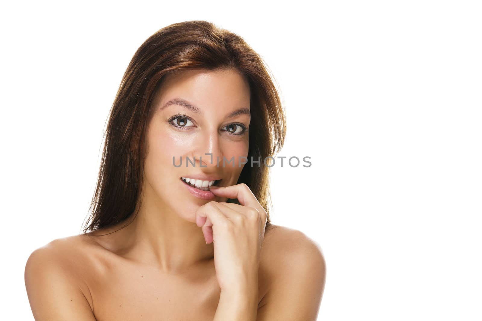 beautiful brunette woman with a finger at her mouth on white background