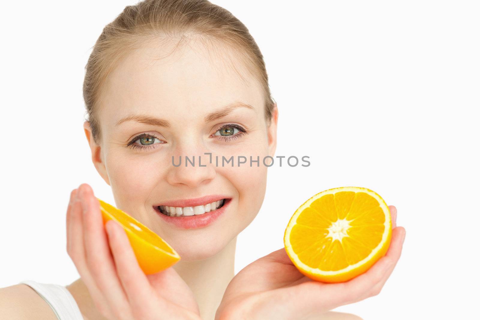Close up of a joyful holding oranges by Wavebreakmedia