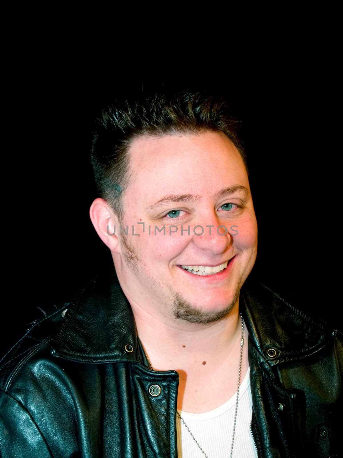 man in leather smiling