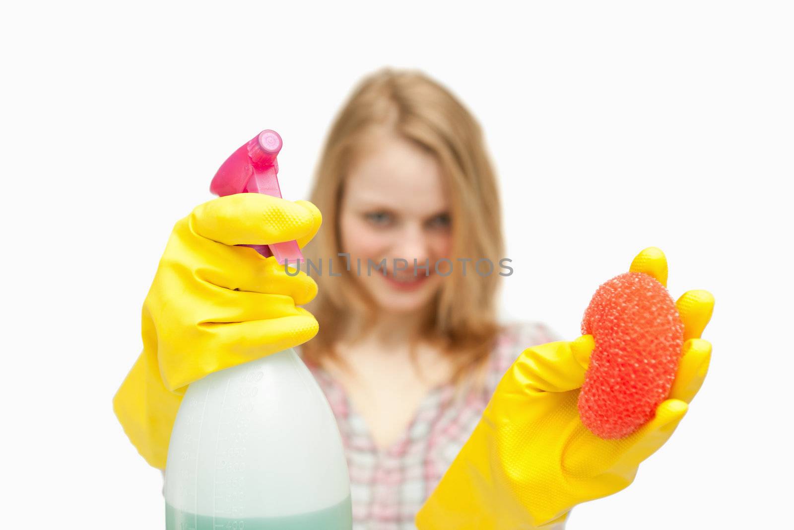 Woman presenting cleaning products against white background