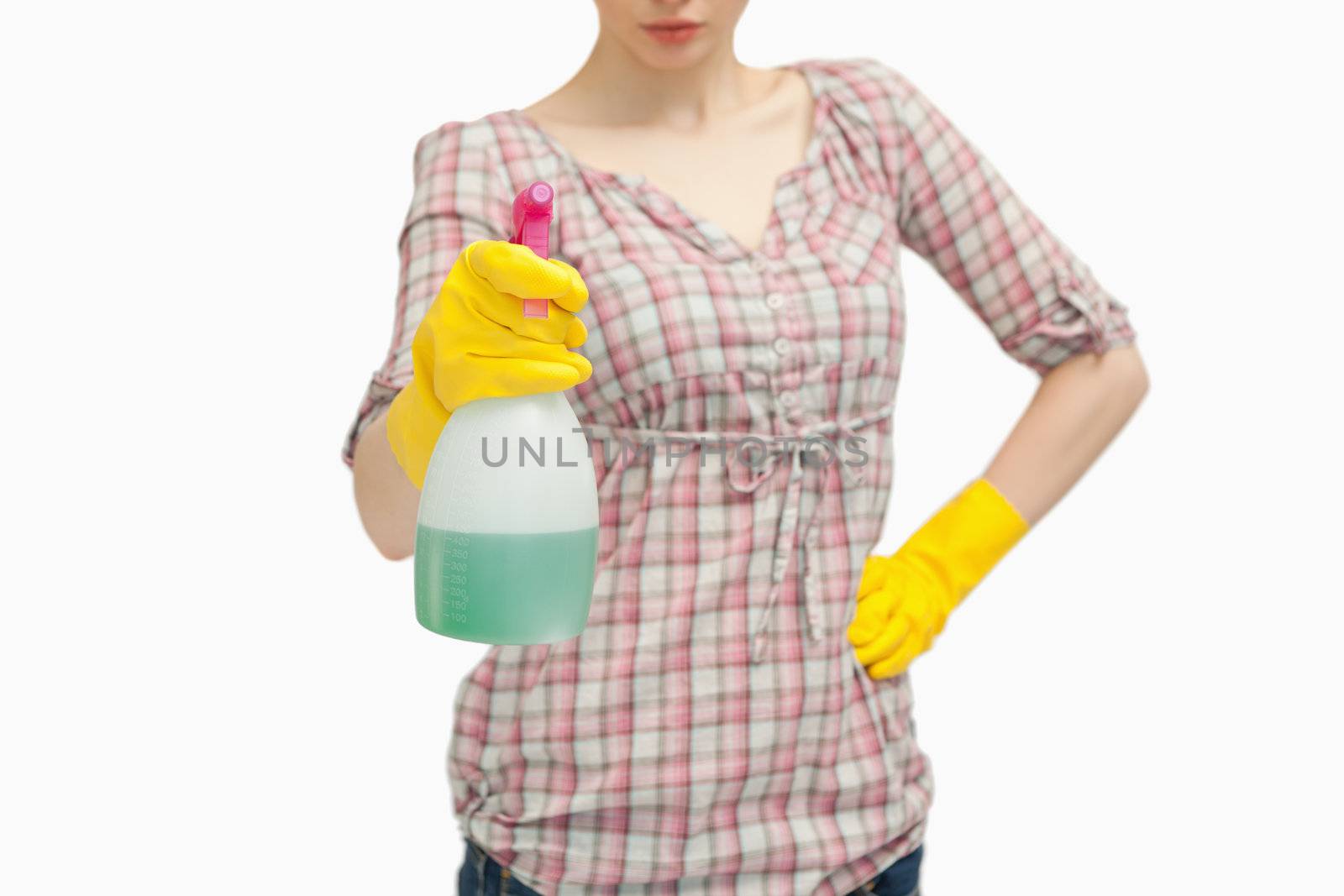 Close up of a woman holding a spray bottle against white background