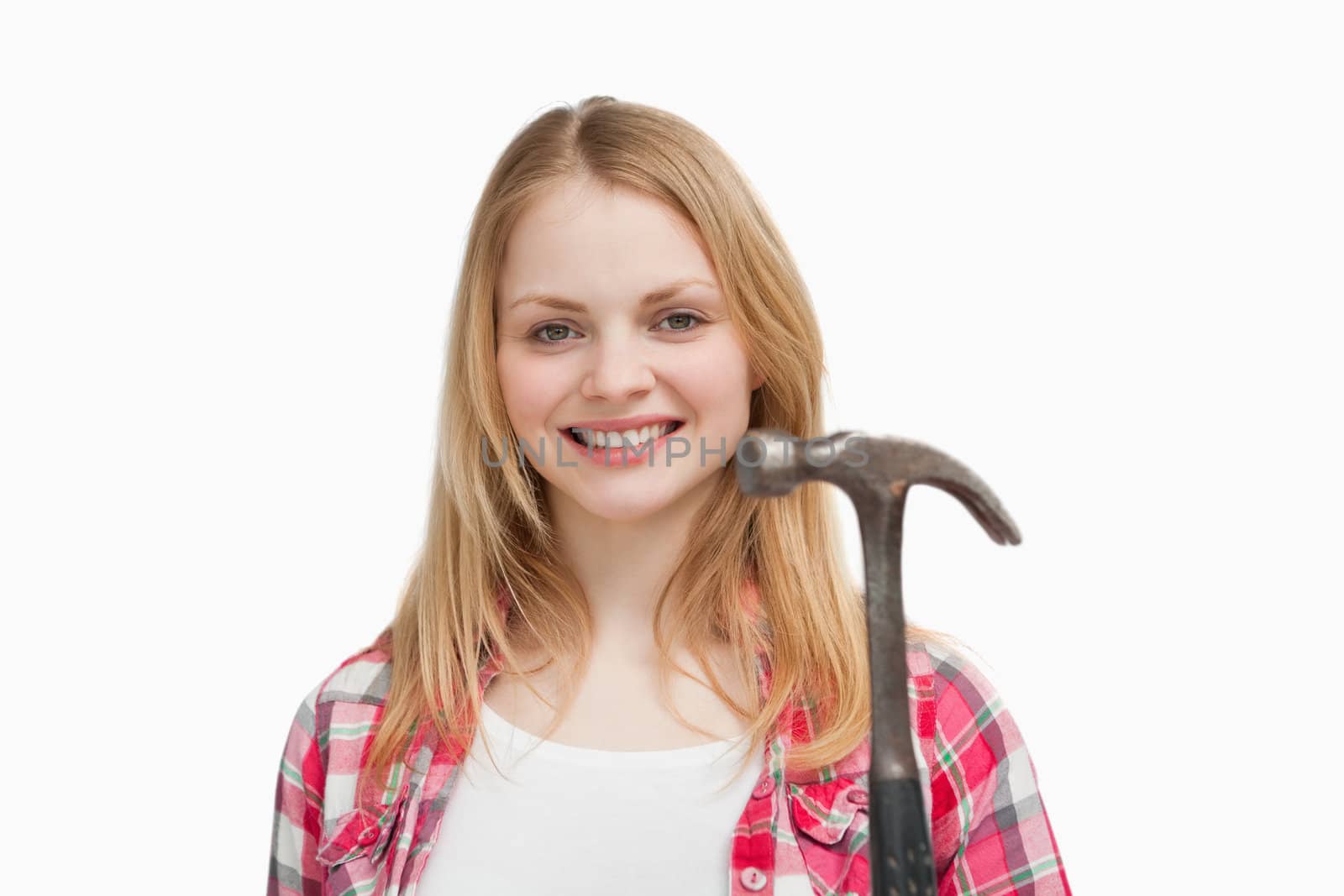 Woman holding a hammer against white background