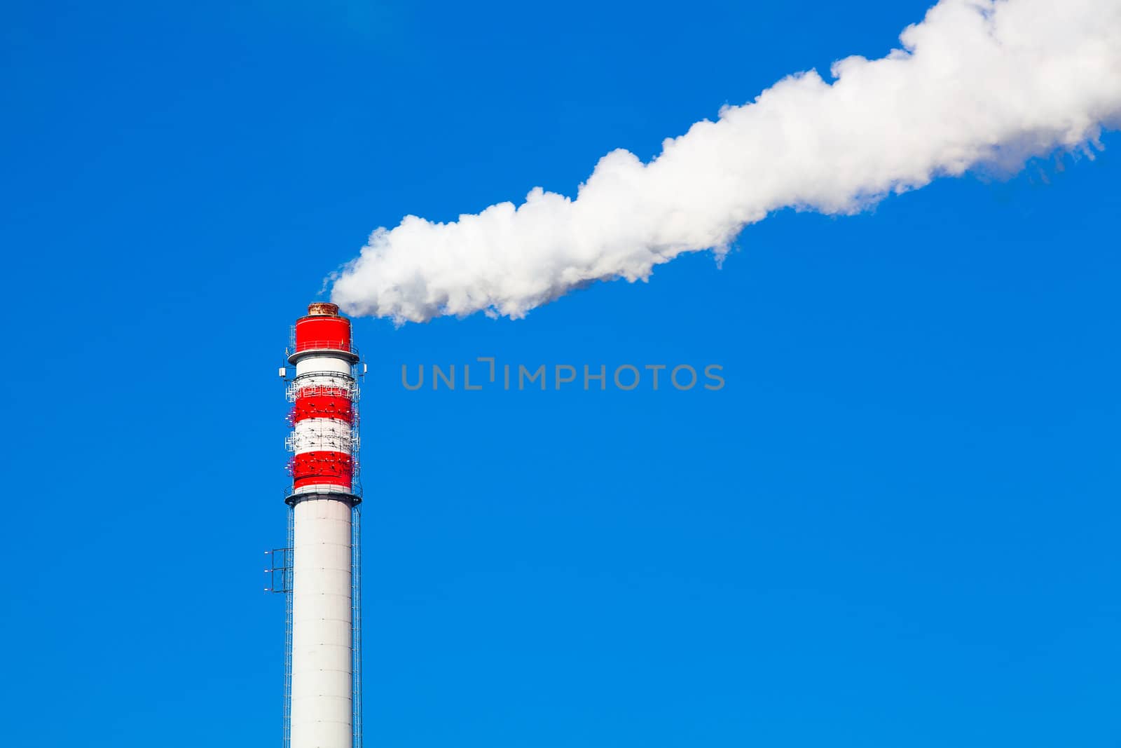 Smoke from a pipe on the blue sky