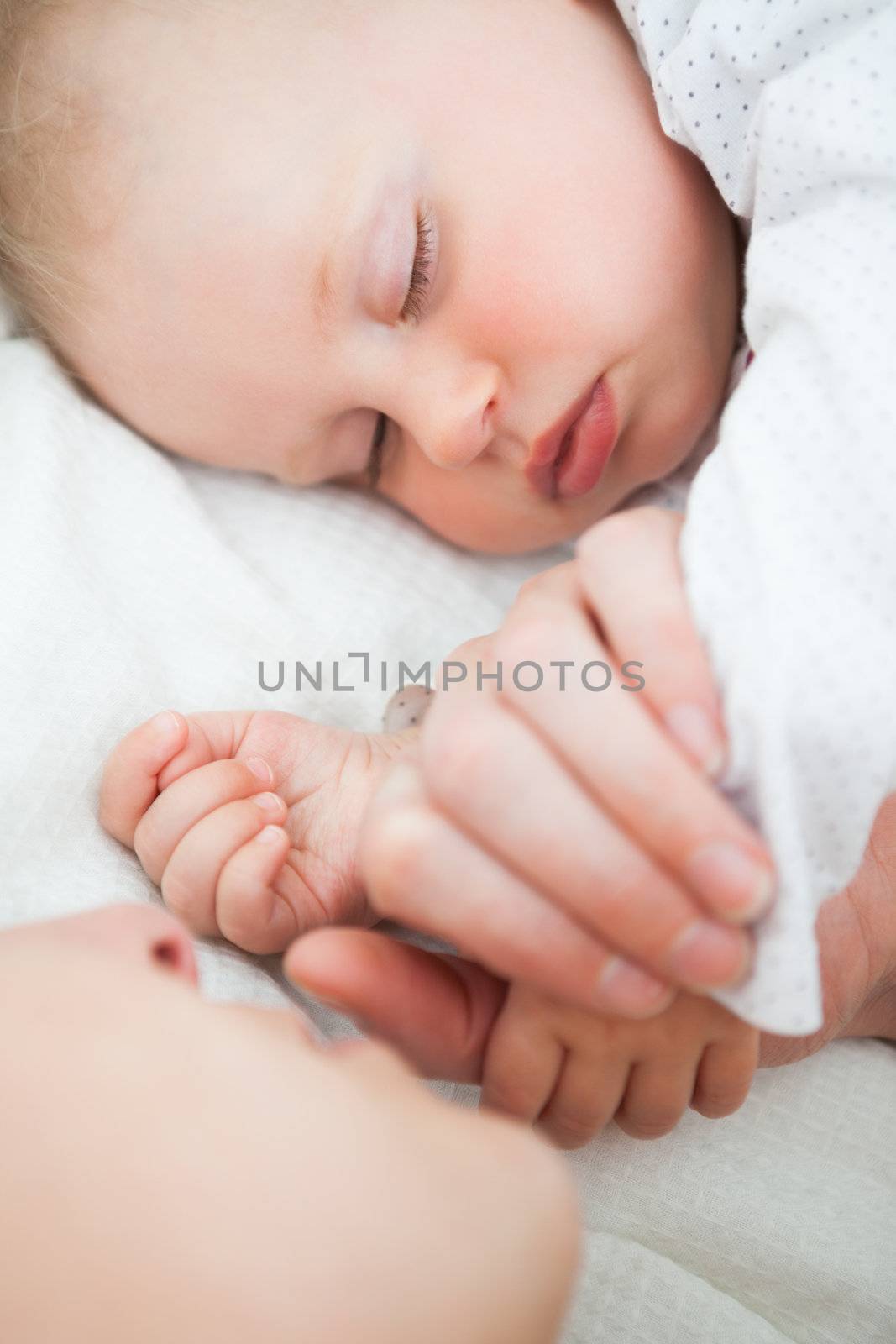 Peaceful little baby sleeping with her mother by Wavebreakmedia