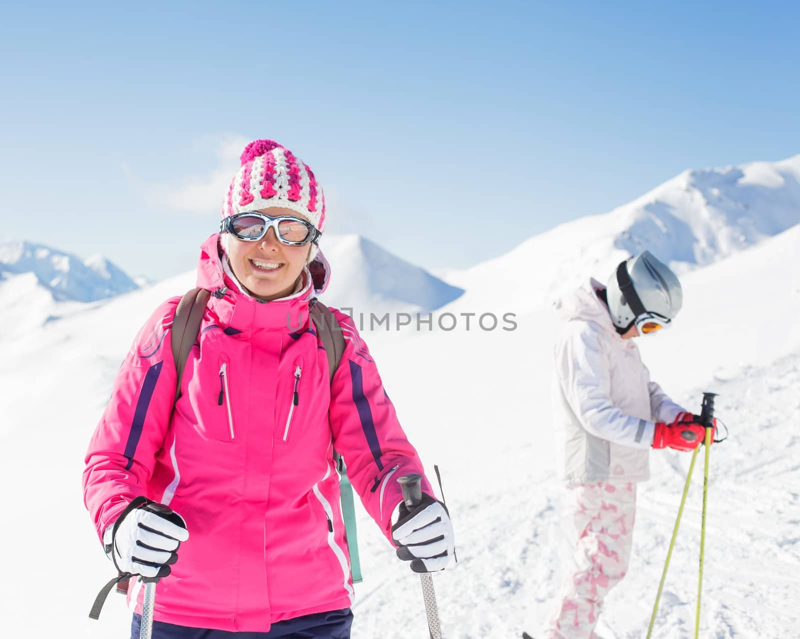 Happy smiling woman in ski goggles and with her daughter, Zellertal, Austria