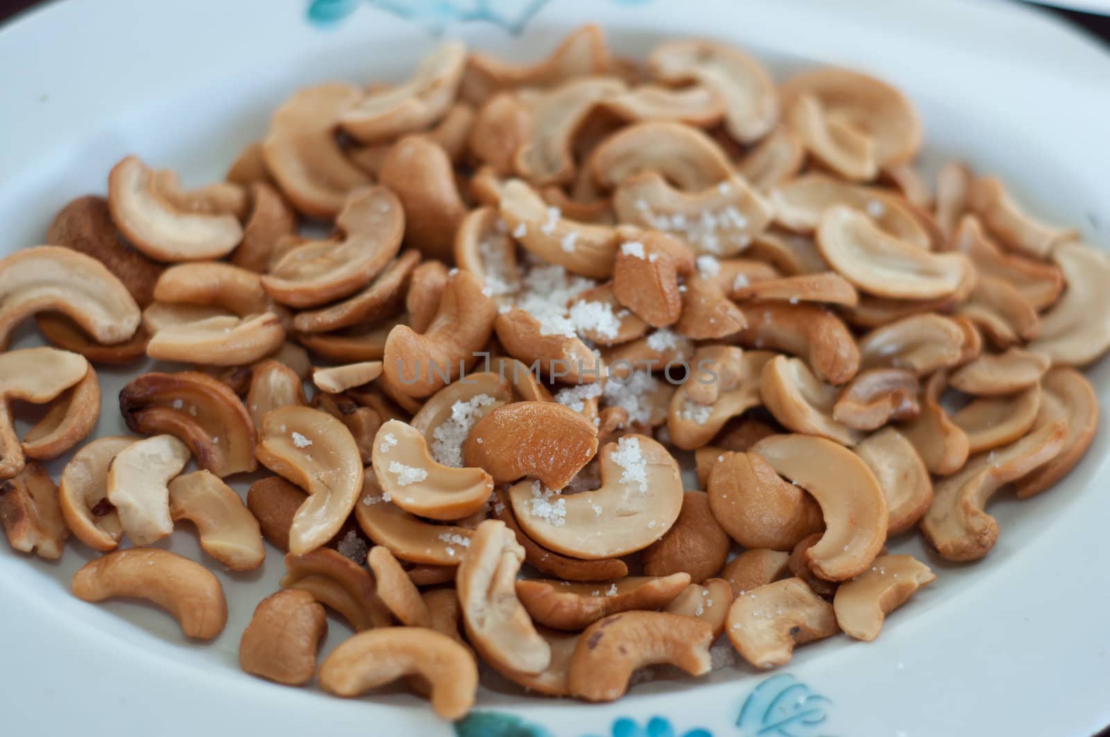 cashew nuts with salt on dish